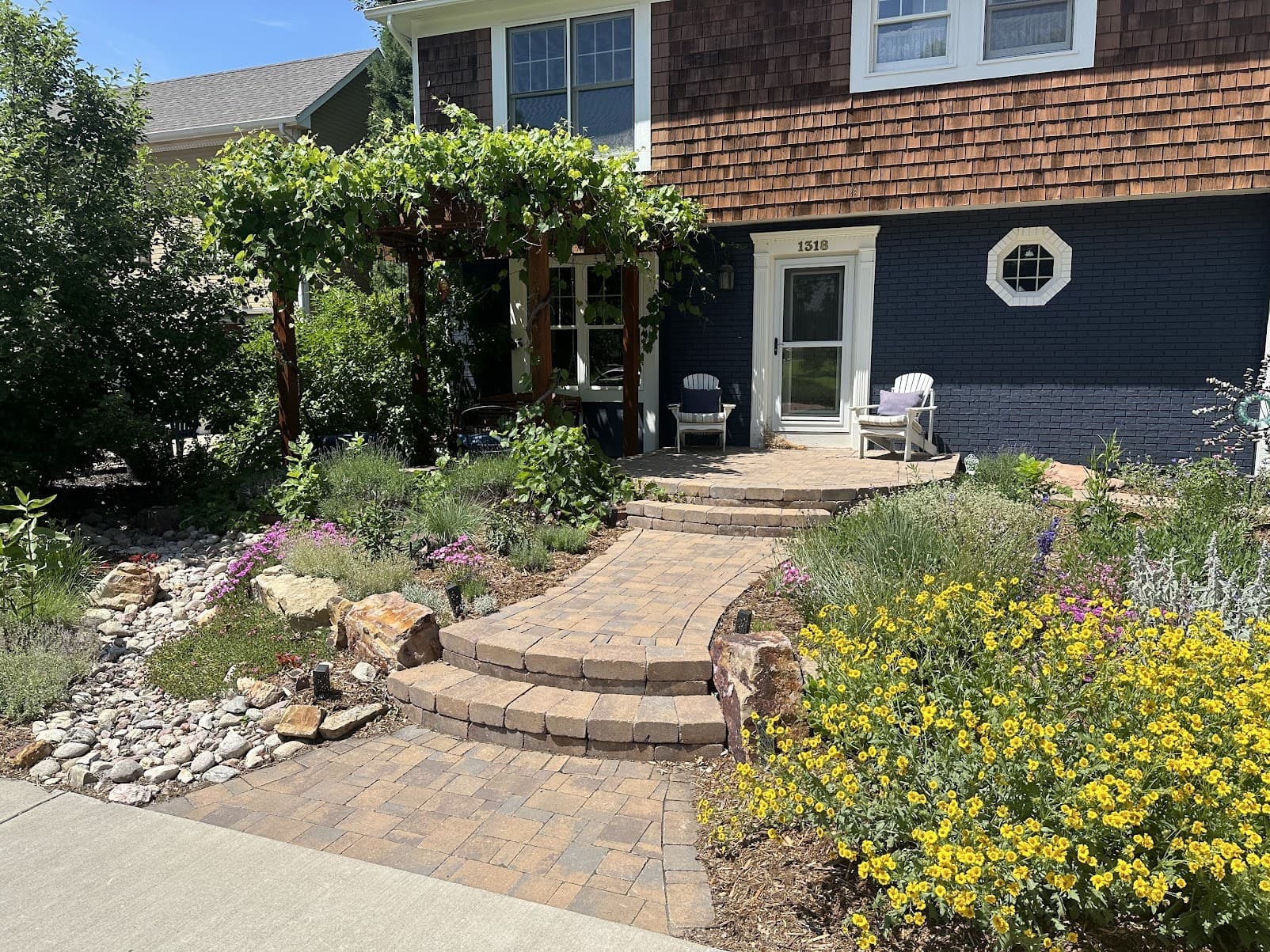 Finished paver walkway with native plantings